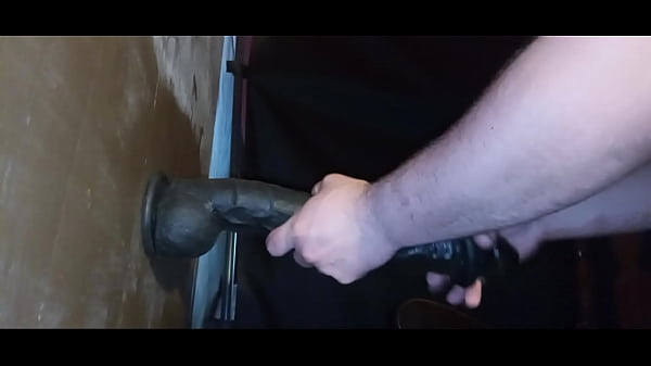 Chubby guy takes long black dildo using rockingchair