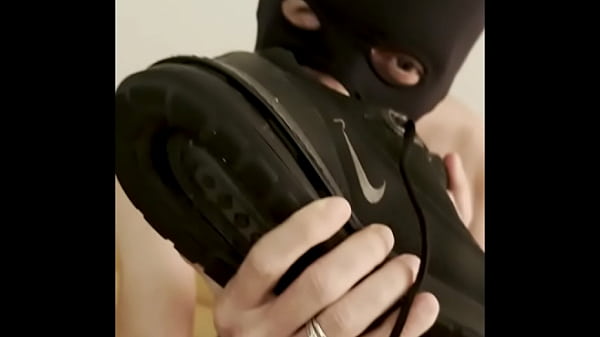 my submissive guy sniffs my sneakers, licks my feet and I play with him