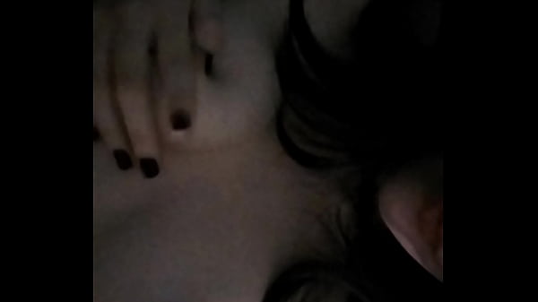 Young girl passionately touches her tits