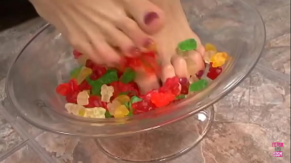 Smoking hot brunette plays with her feet and gets rammed from behind doggy style